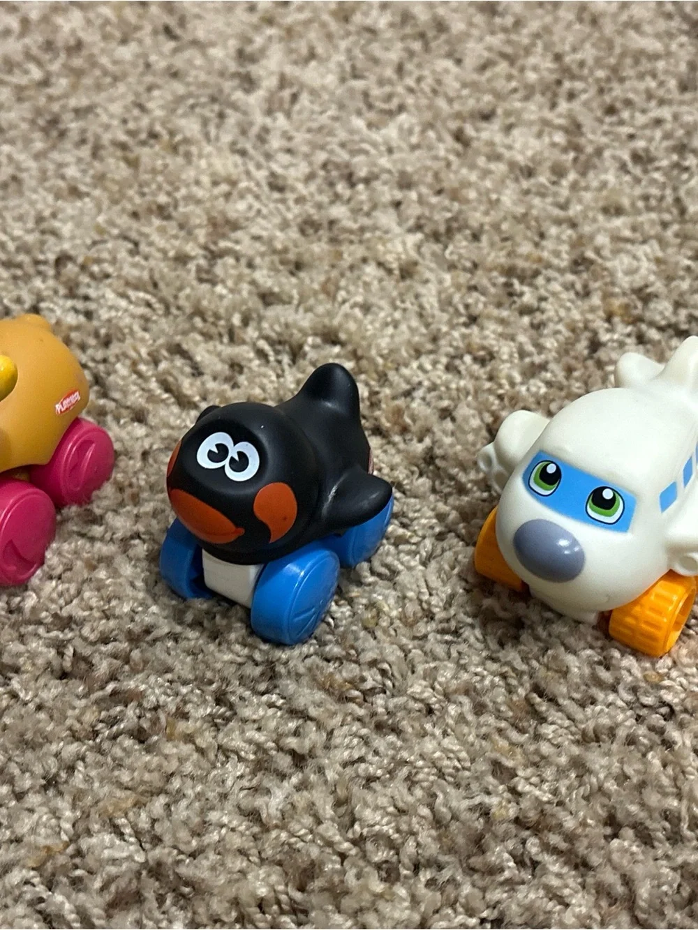 Fisher-Price Black Penguin Push Toy with Blue Wheels and Orange Details